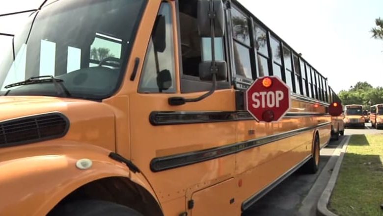 Two vehicles crashed after attempting to pass around a school bus in Boynton Beach