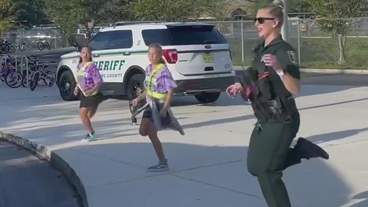 Youth Resource Deputy welcomes students with a fun performance